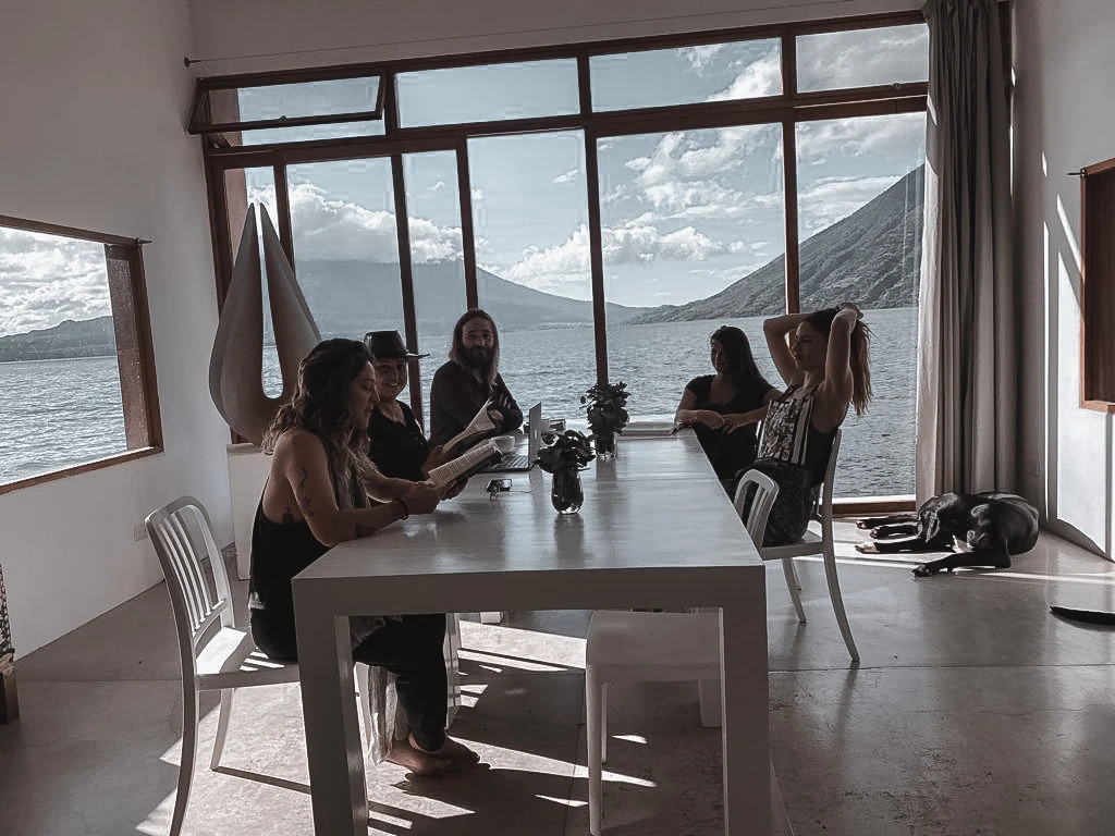 A small group discussing a project around a table.