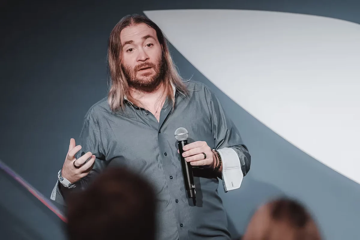 A speaker sharing ideas with an audience.