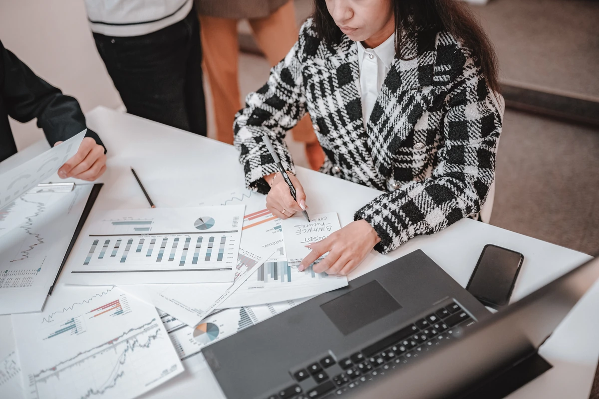 People reviewing a practical project plan at a table.